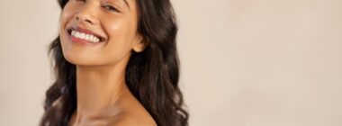 Woman smiling with flawless skin from IPL laser therapy in Denver, CO