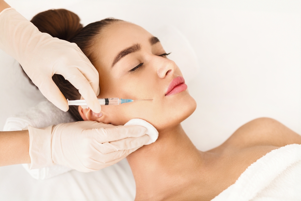 Woman getting Sculptra facial injections in Denver, CO
