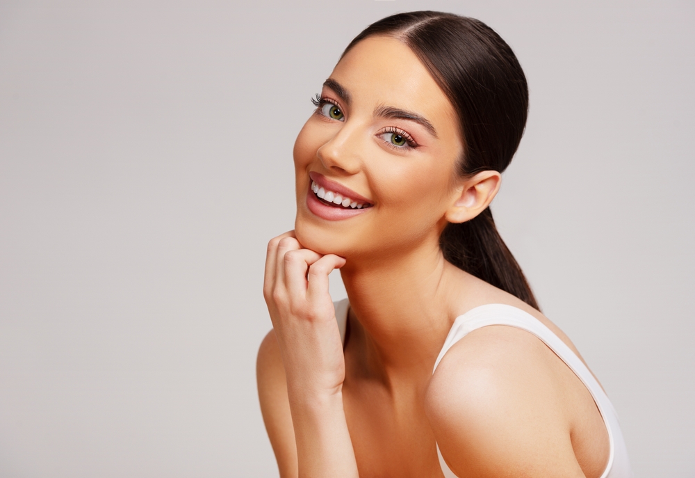 Woman smiling with clear skin from IPL Photofacial in Denver, CO