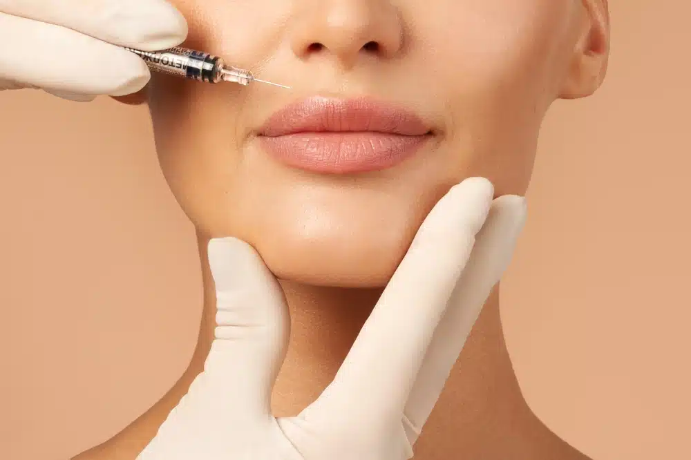 Woman's lips getting lip filler injections in Aurora, CO