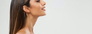 Side profile of woman with slim, defined chin and neck from Kybella in Denver, CO