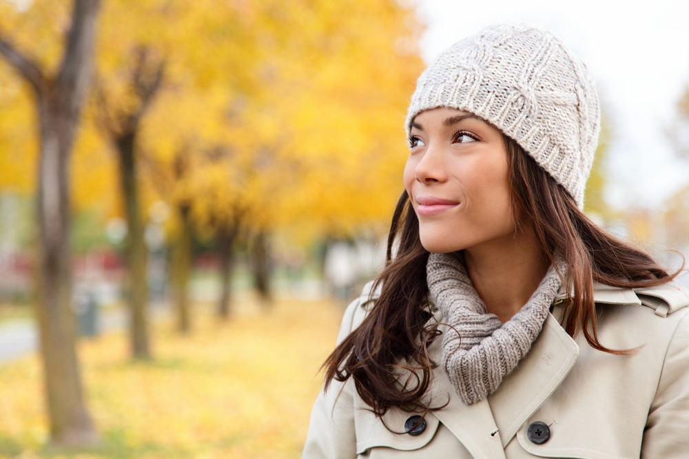 Woman in fall setting with clear skin after IPL in Denver, CO